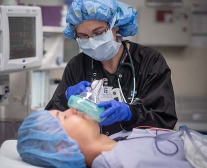 anesthesiologist administering anesthesia