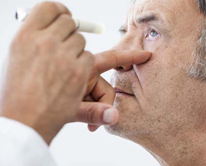 older patient getting eye examined