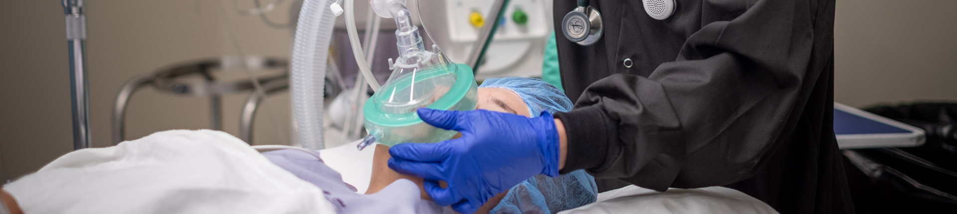 anesthesiologist administering anesthesia