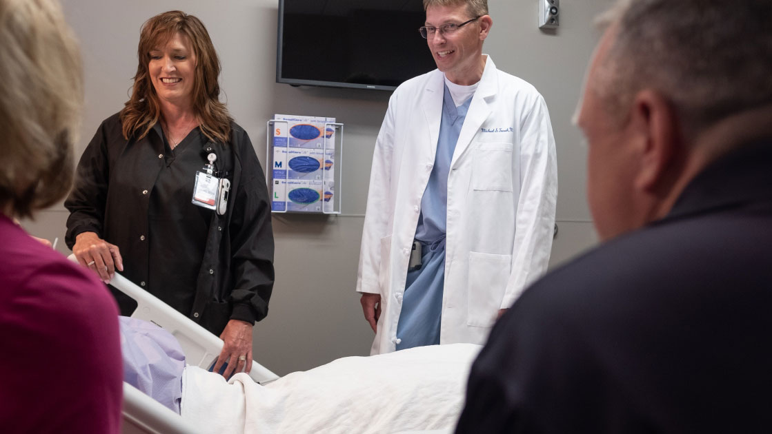 doctors in room with patient